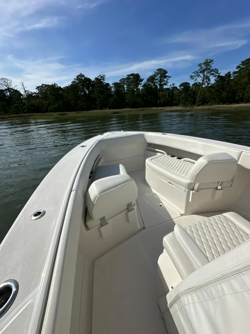 Slide: The Image of 2019 Jupiter 30 HFS boat with white interior on a calm lake. - 18