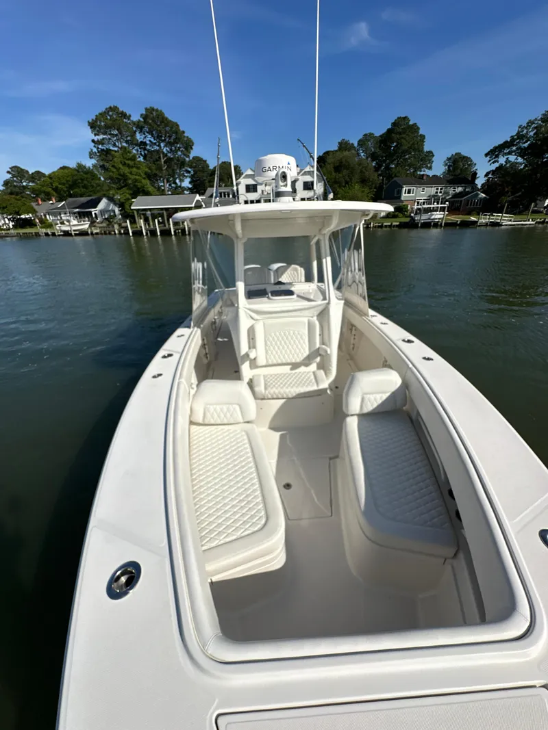 Slide: The Image of 2019 Jupiter 30 HFS boat on calm water, featuring sleek white design. - 19