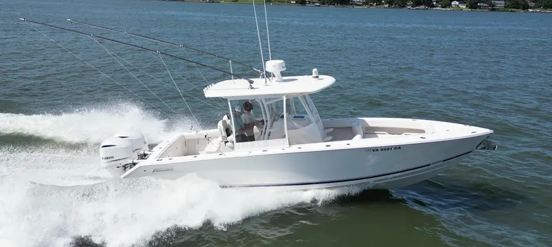 Slide: The Image of 2019 Jupiter 30 HFS boat cruising on open water, side view. - 2