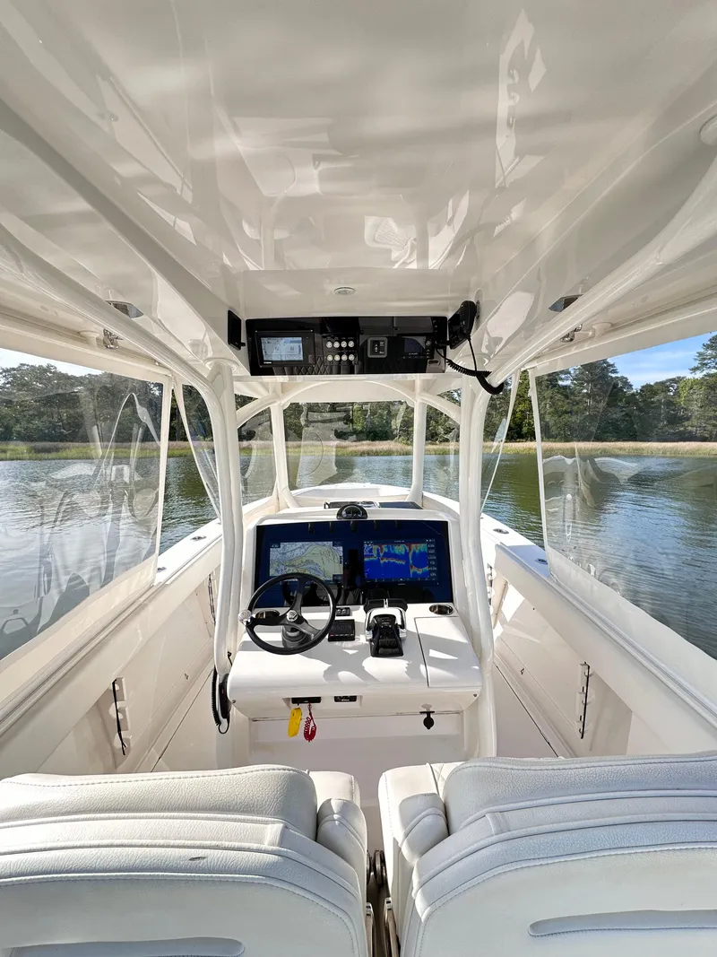Slide: The Image of 2019 Jupiter 30 HFS boat interior with modern helm and dual seating. - 22