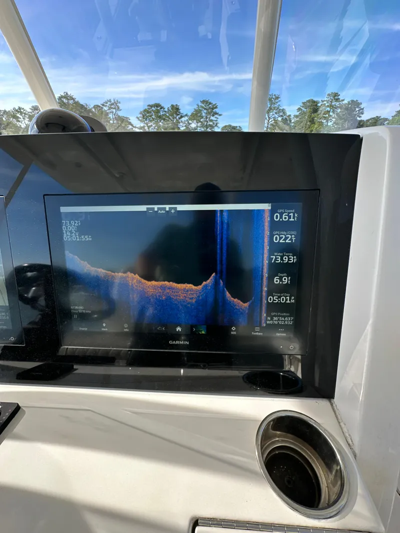 Slide: The Image of 2019 Jupiter 30 HFS boat with fish finder display showing underwater topography. - 23