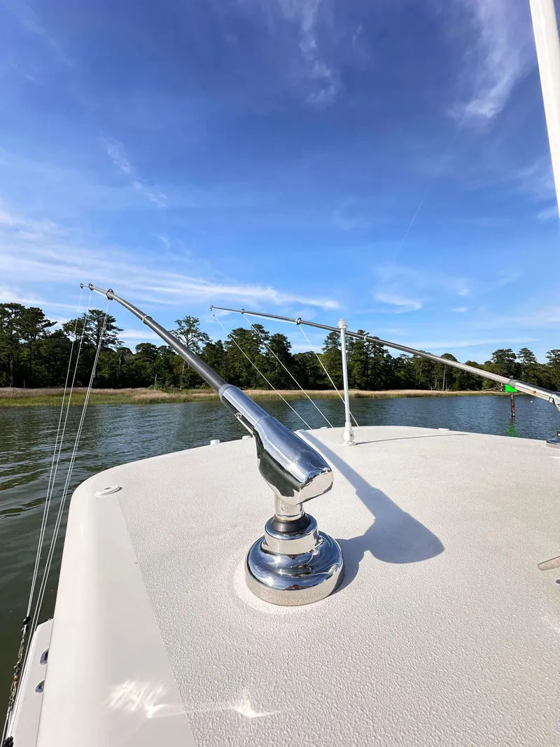 Slide: The Image of 2019 Jupiter 30 HFS boat deck with clear sky and water view. - 30