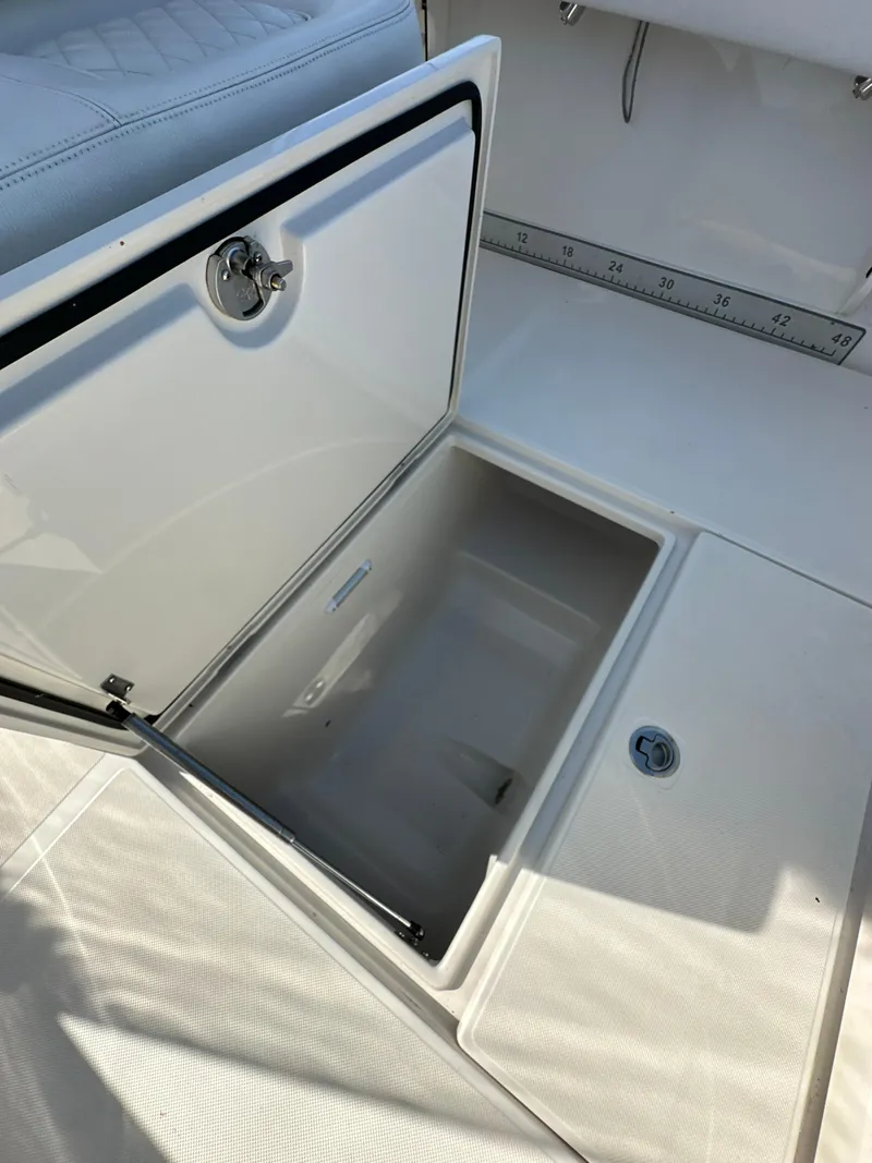 Slide: The Image of Open storage compartment on 2019 Jupiter 30 HFS boat deck. - 36