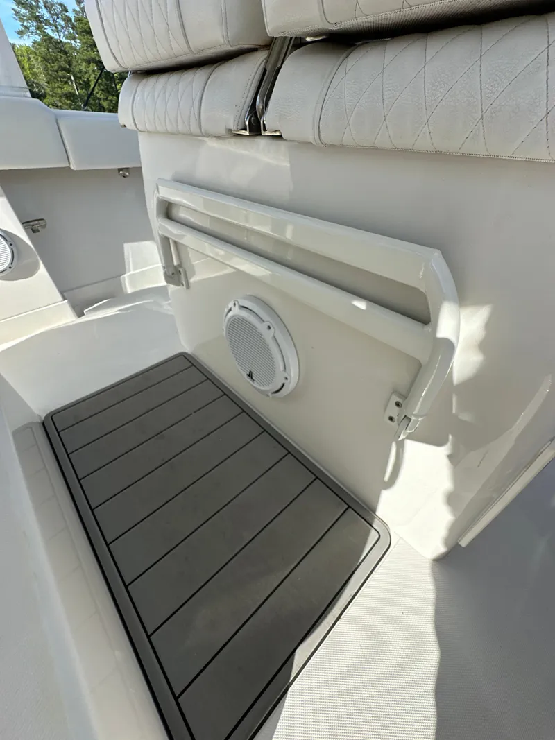 Slide: The Image of 2019 Jupiter 30 HFS boat interior with cushioned seating and deck details. - 37