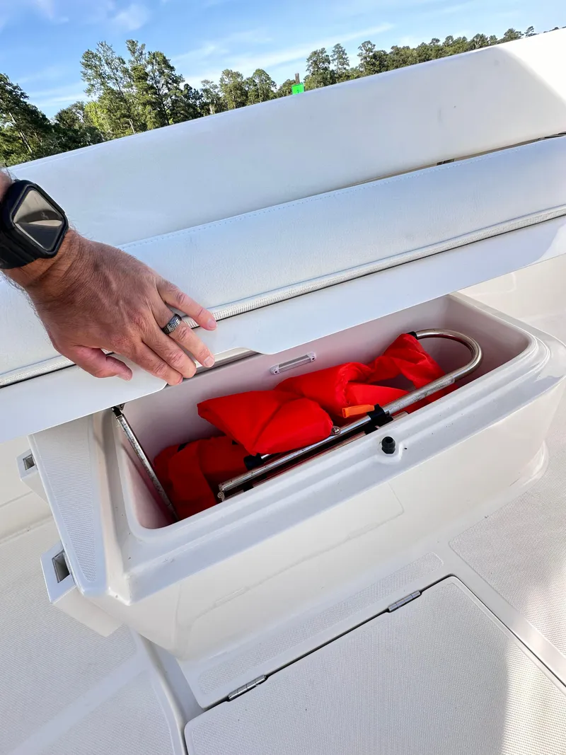 Slide: The Image of 2019 Jupiter 30 HFS boat storage compartment with life jackets. - 45