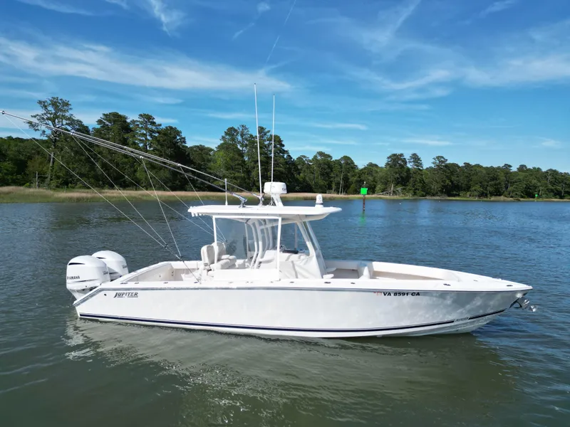 Slide: The Image of 2019 Jupiter 30 HFS boat on calm water under blue sky. - 6