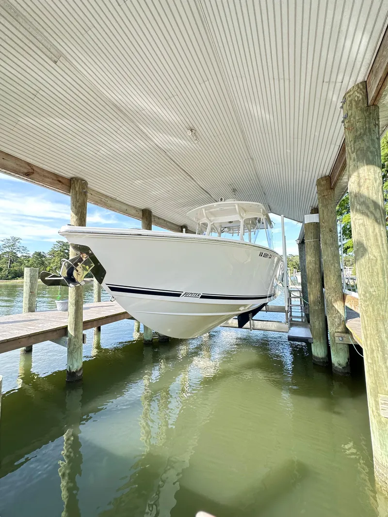 Slide: The Image of 2019 Jupiter 30 HFS boat docked in covered marina. - 8