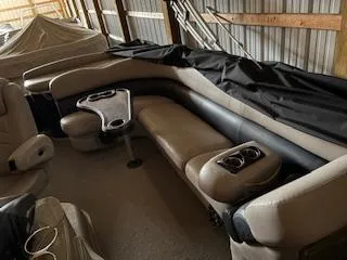 Slide: The Image of 2012 Premier 250 Grand Majestic LTD boat interior with beige seating and cup holders. - 5