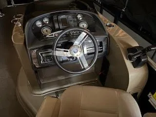 Slide: The Image of Steering console of 2012 Premier 250 Grand Majestic LTD boat with gauges and controls. - 7