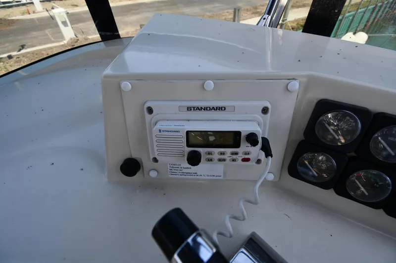 Slide: The Image of 1988 Tollycraft 34 Sundeck boat radio and control panel. - 17