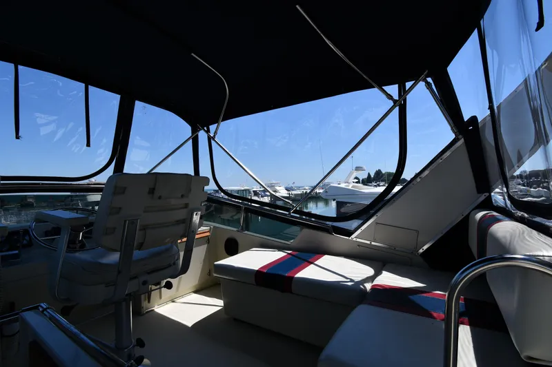 Slide: The Image of Interior view of 1988 Tollycraft 34 Sundeck yacht with marina in background. - 21