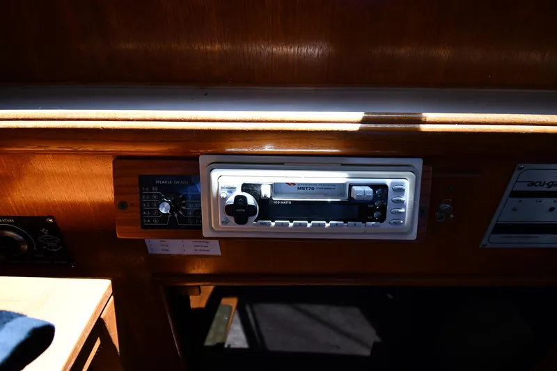 Slide: The Image of 1988 Tollycraft 34 Sundeck interior control panel with stereo system. - 49