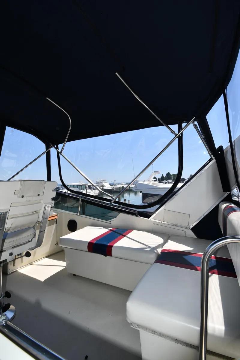 Slide: The Image of 1988 Tollycraft 34 Sundeck interior with seating and canopy. - 22