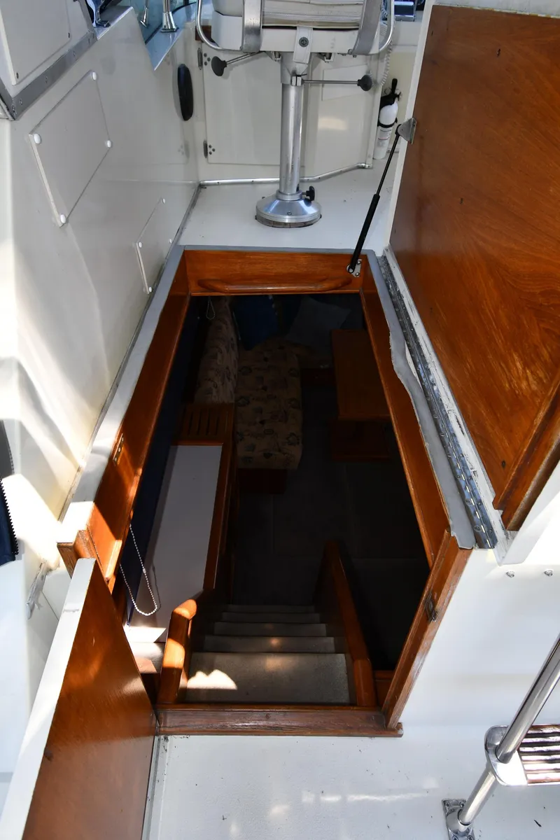 Slide: The Image of Interior view of 1988 Tollycraft 34 Sundeck yacht, showing stairs leading to cabin. - 27