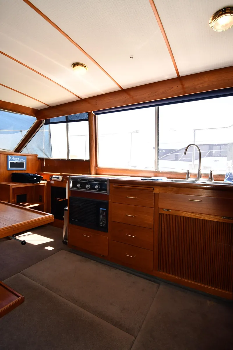 Slide: The Image of Interior of 1988 Tollycraft 34 Sundeck yacht with kitchen and seating area. - 37