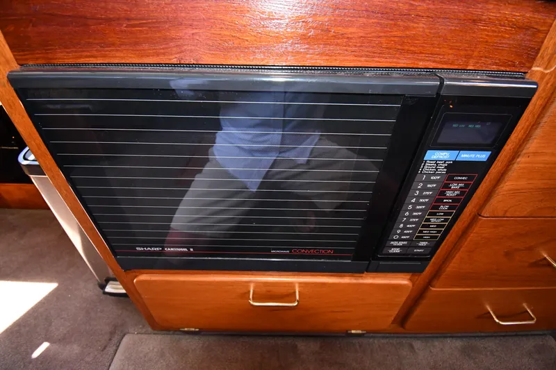 Slide: The Image of Sharp Carousel II microwave in 1988 Tollycraft 34 Sundeck yacht interior. - 46