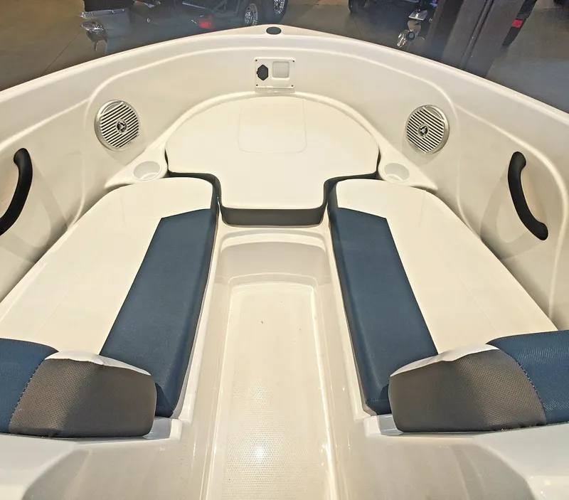 Slide: The Image of 2024 Tahoe 185 S boat interior with blue and white seating. - 2