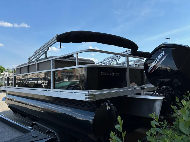 Slide: The Image of 2024 Ranger Reata 200F pontoon boat with Mercury outboard motor. - 1