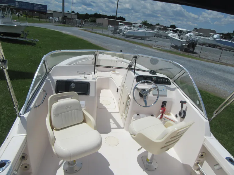 Slide: The Image of 2009 Grady-White Tournament 185 boat interior with dual seats and steering console. - 11