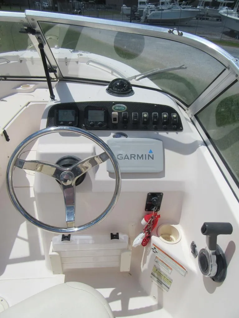 Slide: The Image of 2009 Grady-White Tournament 185 boat dashboard with Garmin navigation system. - 13