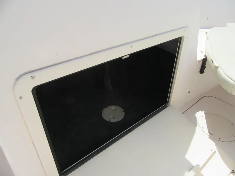 Slide: The Image of Storage compartment on a 2009 Grady-White Tournament 185 boat. - 16
