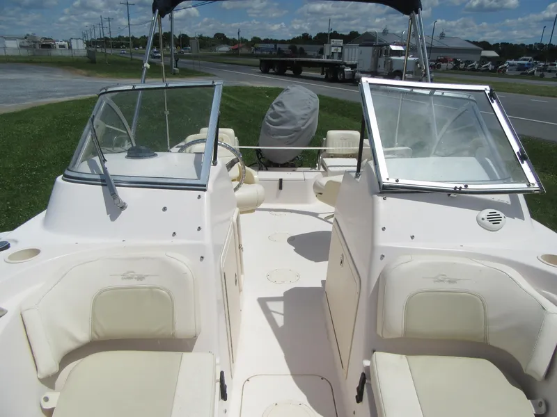 Slide: The Image of 2009 Grady-White Tournament 185 boat interior with seating and windshield. - 23