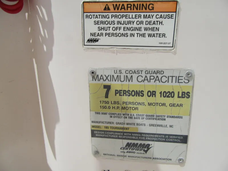 Slide: The Image of Warning and capacity labels on a 2009 Grady-White Tournament 185 boat. - 24
