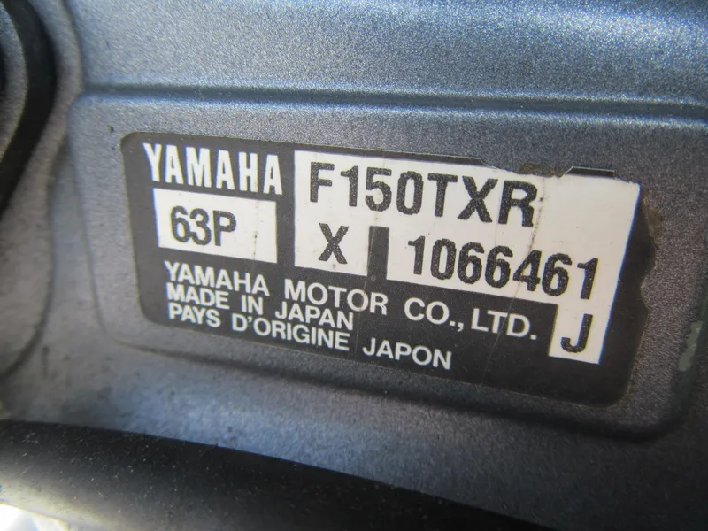 Slide: The Image of Yamaha F150TXR engine label on a 2009 Grady-White Tournament 185 boat. - 6