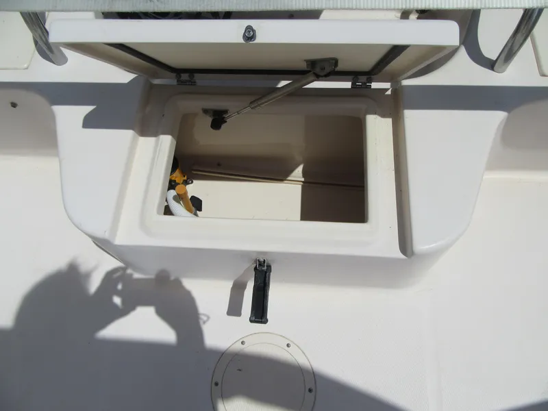 Slide: The Image of Open storage compartment on a 2009 Grady-White Tournament 185 boat. - 8