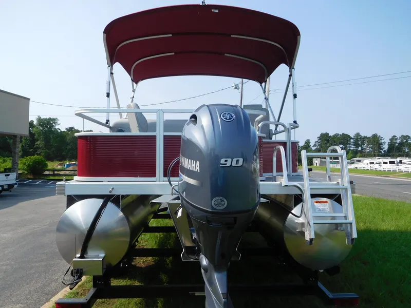 Slide: The Image of 2024 Bennington 20 SVF pontoon boat with Yamaha 90 engine, red canopy, and aluminum pontoons. - 11