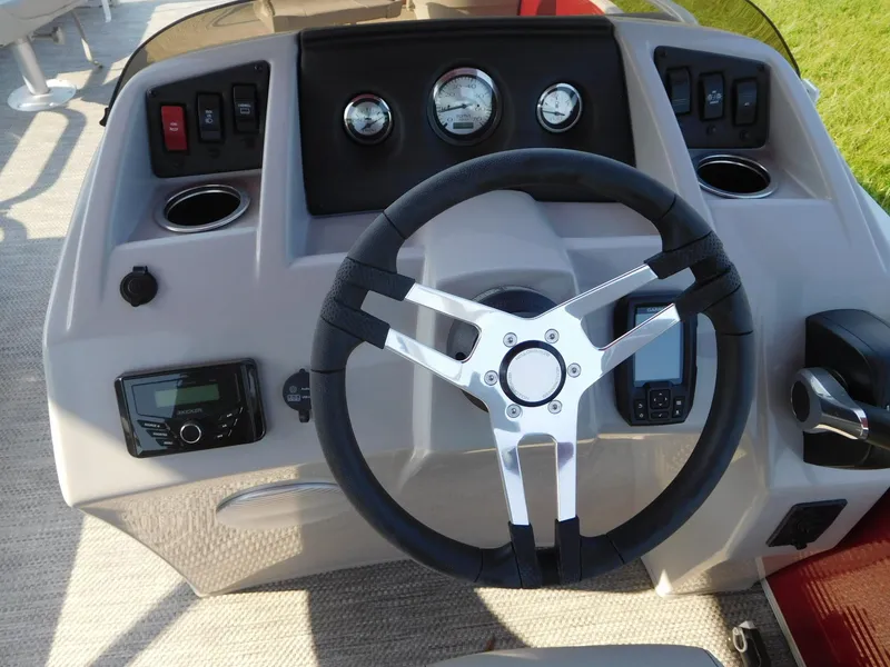 Slide: The Image of 2024 Bennington 20 SVF boat dashboard with steering wheel and control panel. - 2