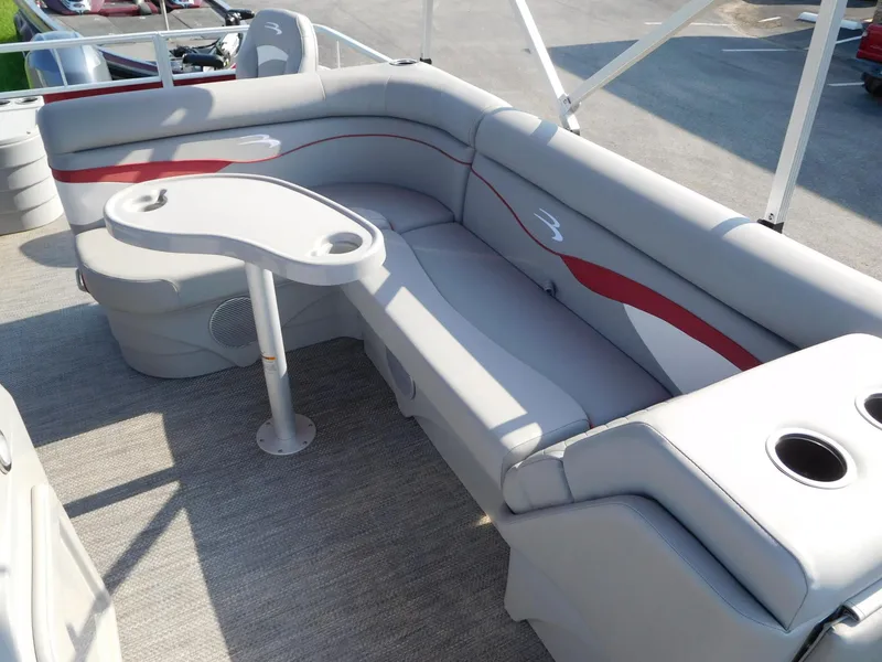 Slide: The Image of 2024 Bennington 20 SVF pontoon boat interior with gray and red seating. - 4