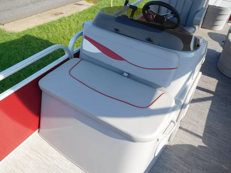 Slide: The Image of 2024 Bennington 20 SVF boat interior with cushioned seating and steering console. - 5