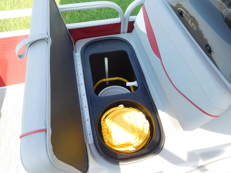 Slide: The Image of 2024 Bennington 20 SVF boat storage compartment with yellow rope and accessories. - 6
