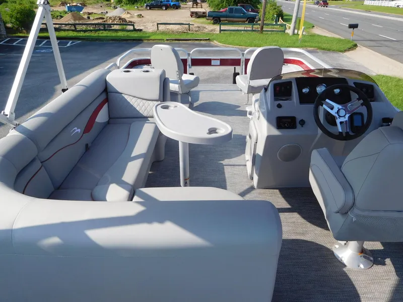 Slide: The Image of 2024 Bennington 20 SVF pontoon boat interior with seating and steering console. - 8