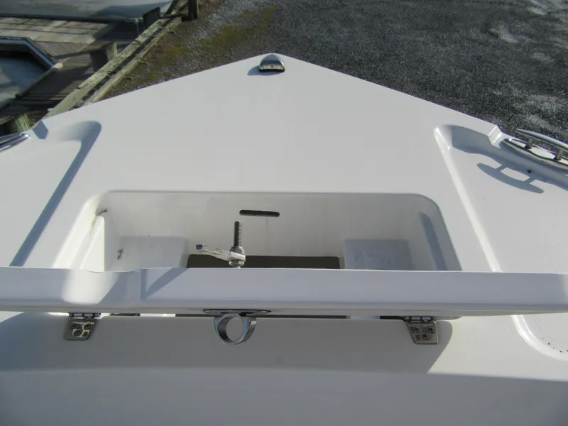 Slide: The Image of 2024 Parker 18SE Center Console boat, open storage compartment on deck. - 10