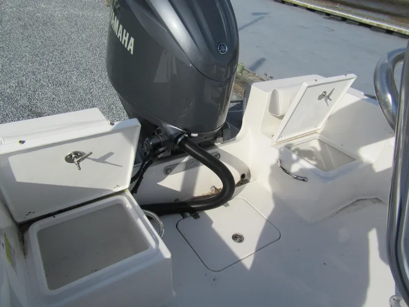 Slide: The Image of 2024 Parker 18SE Center Console boat with Yamaha engine and open storage compartments. - 11