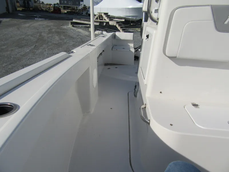 Slide: The Image of 2024 Parker 18SE Center Console boat interior, featuring sleek white design and spacious layout. - 7