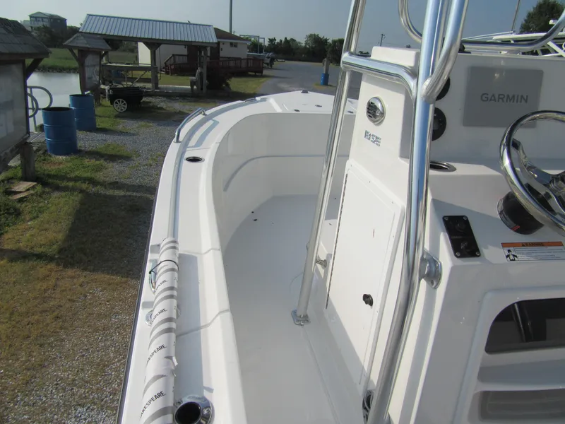 Slide: The Image of 2024 Parker 18SE Center Console boat with Garmin navigation system, docked outdoors. - 10