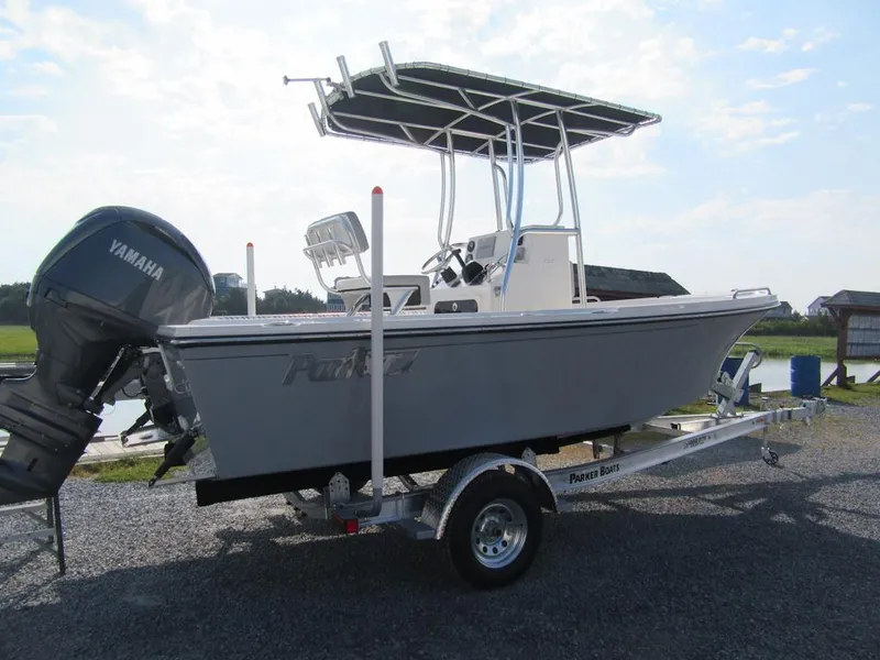 Slide: The Image of 2024 Parker 18SE Center Console boat on trailer with Yamaha outboard motor. - 2