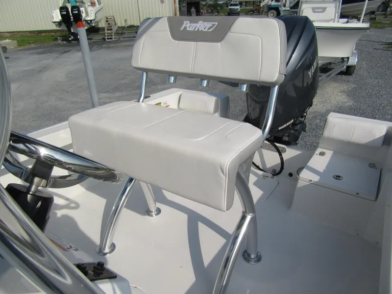 Slide: The Image of 2024 Parker 18SE Center Console boat with cushioned seating and steering wheel. - 5