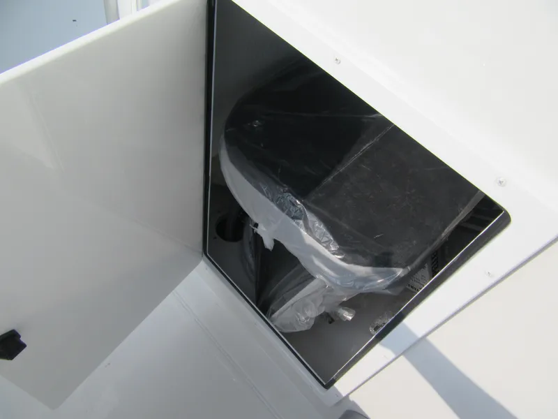 Slide: The Image of Storage compartment on 2024 Parker 18SE Center Console boat. - 6