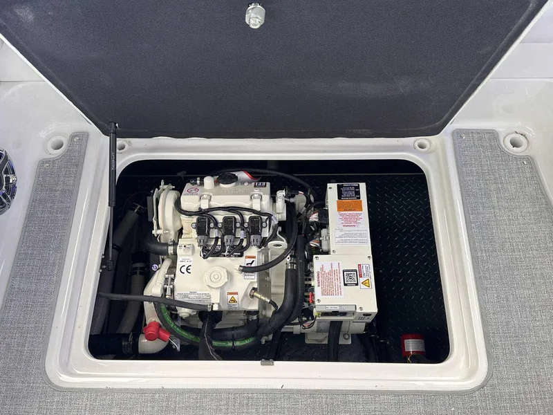 Slide: The Image of 2025 Formula 350 Crossover Bowrider I/O engine compartment, showcasing internal components. - 13