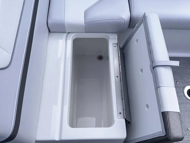 Slide: The Image of 2025 Formula 350 Crossover Bowrider I/O storage compartment with open lid. - 15