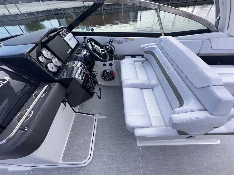 Slide: The Image of 2025 Formula 350 Crossover Bowrider I/O interior with sleek dashboard and white seating. - 22