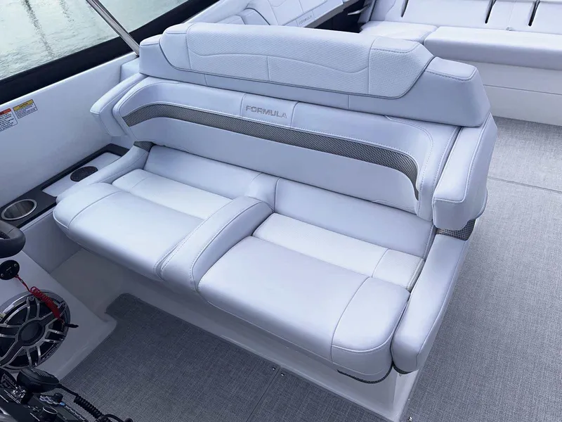 Slide: The Image of 2025 Formula 350 Crossover Bowrider I/O interior with luxurious white seating. - 23