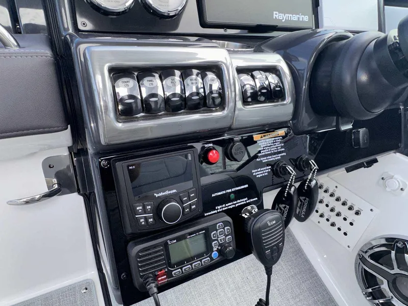 Slide: The Image of Control panel of 2025 Formula 350 Crossover Bowrider I/O with advanced navigation systems. - 27