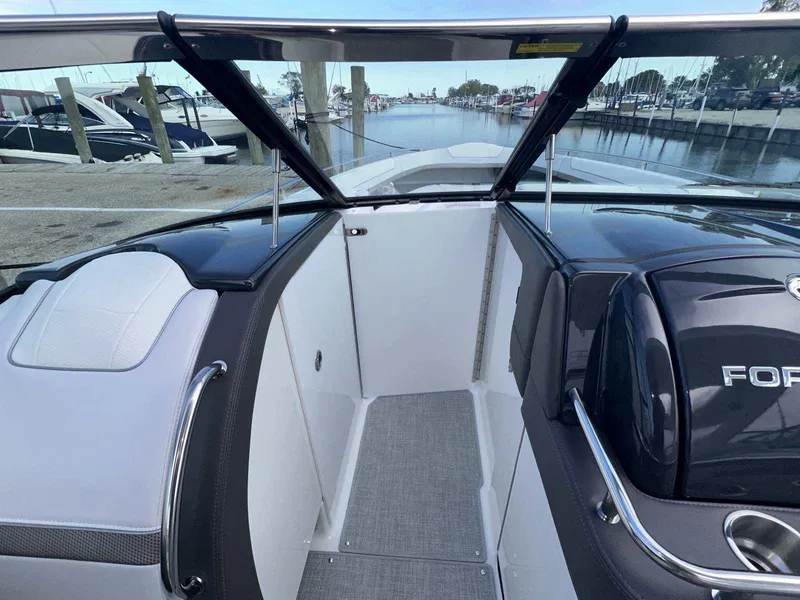 Slide: The Image of 2025 Formula 350 Crossover Bowrider I/O, sleek design, docked at marina. - 28