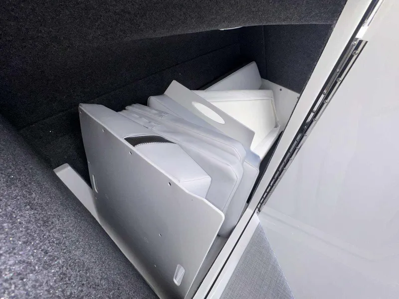 Slide: The Image of 2025 Formula 350 Crossover Bowrider I/O interior storage compartment with white dividers. - 30