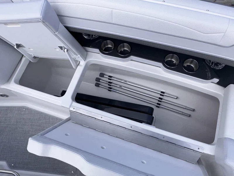 Slide: The Image of 2025 Formula 350 Crossover Bowrider I/O storage compartment with cup holders and accessories. - 35